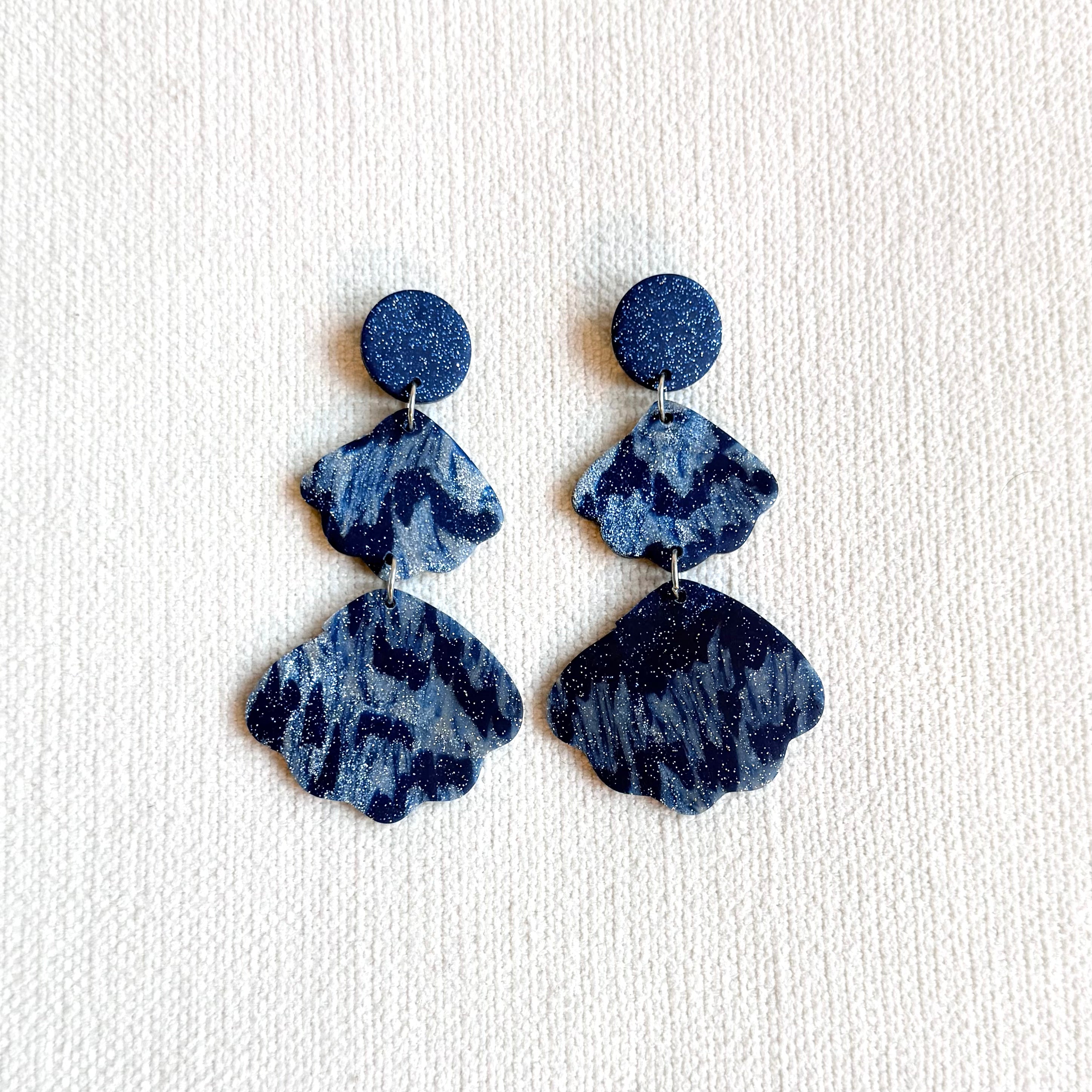 Blue and glittery seashell-shaped earrings
